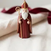 A painted wooden ornament of St. Nicholas as a bishop with miter and crozier